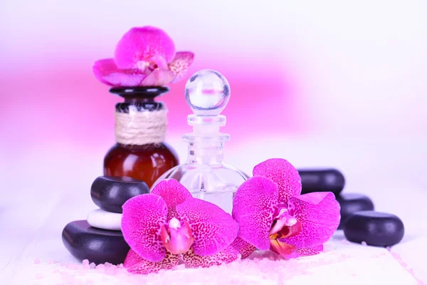 Beautiful spa setting with orchid on white wooden table on bright background — Stock Photo, Image