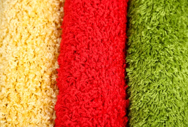 Many carpets of different colors close-up — Stock Photo, Image
