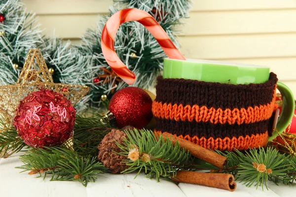 Cup of hot cacao with Christmas decorations on table on wooden background — Stock Photo, Image