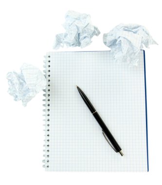Crumpled paper balls with notebook and pen isolated on white clipart