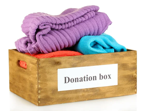 Donation box with clothing isolated on white — Stock Photo, Image