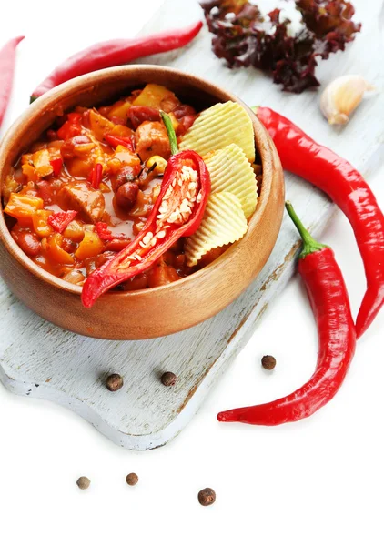 Chili Corn Carne - traditional mexican food, in wooden bowl, on napkin, isolated on white — Stock Photo, Image