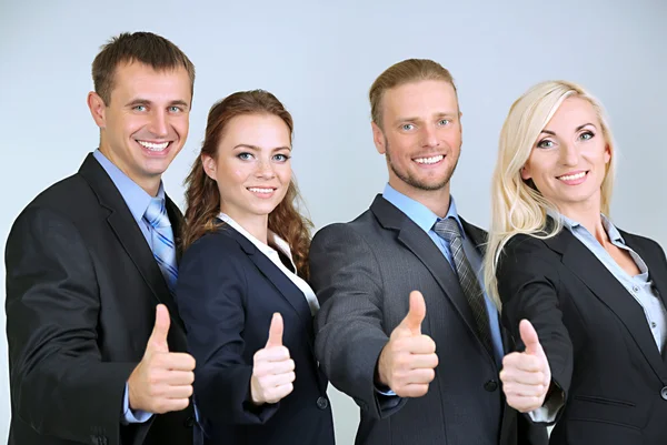 Group of business people on gray background — Stock Photo, Image