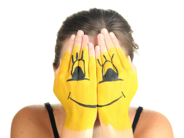 Retrato de chica escondiendo su cara bajo máscara de sonrisa aislada en blanco —  Fotos de Stock