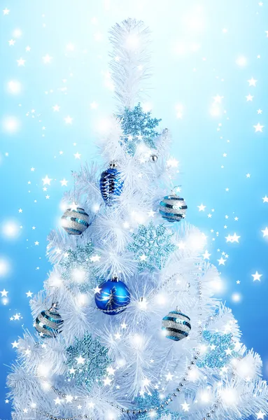 White Christmas tree on blue background — Stock Photo, Image