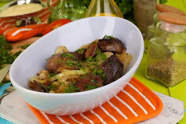 Fried chicken livers in pan on wooden table close-up — Stock Photo, Image