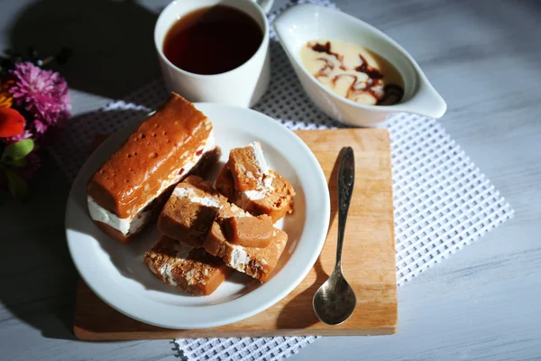 Sherbet with nuts on plate on wooden table close-up — Stock Photo, Image