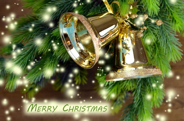 Cloches avec décoration de Noël sur fond en bois — Photo