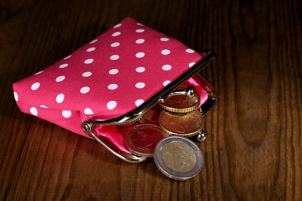 Pink purse with money on table close-up — Stock Photo, Image