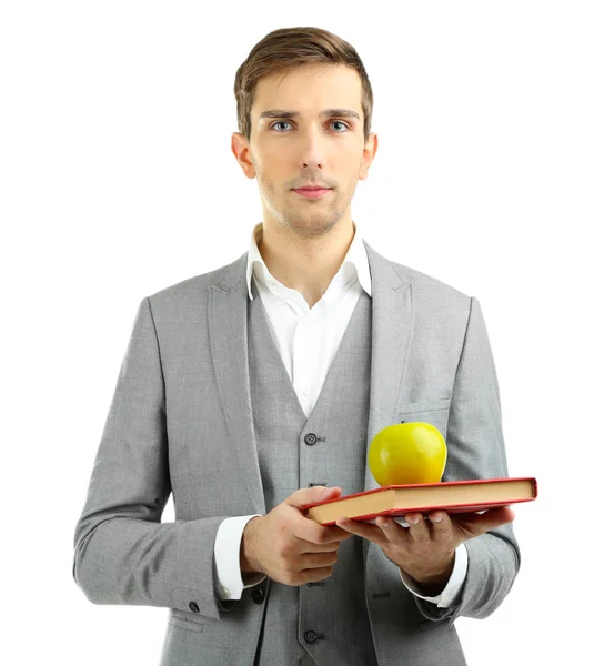 Jonge leraar met boek en appel geïsoleerd op wit — Stockfoto