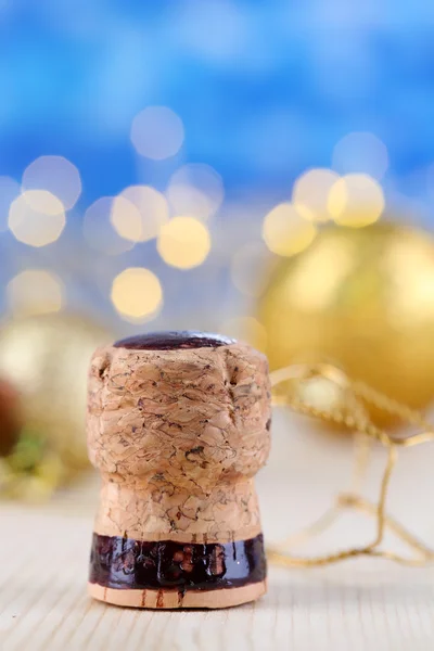 Champagne cork on Christmas lights background — Stock Photo, Image