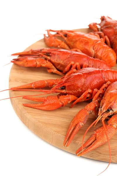 Tasty boiled crayfishes on chopping board isolated on white — Stock Photo, Image