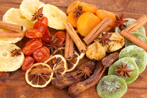 Dried fruits with cinnamon and anise stars close-up — Stock Photo, Image