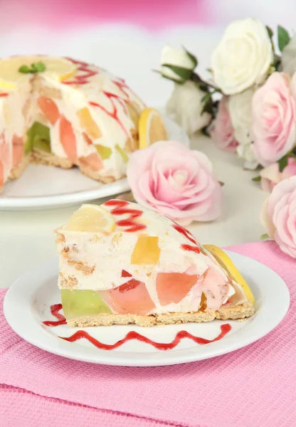 Delicious jelly cake on table on light background — Stock Photo, Image