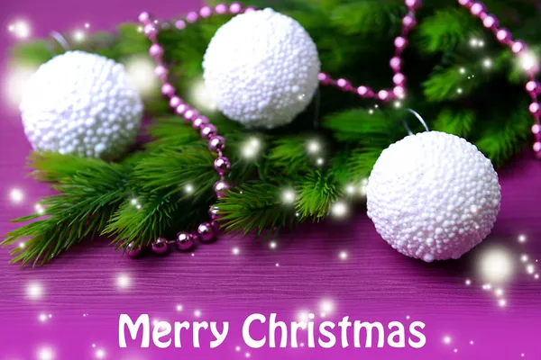 Christmas balls on fir tree, on color background — Stock Photo, Image