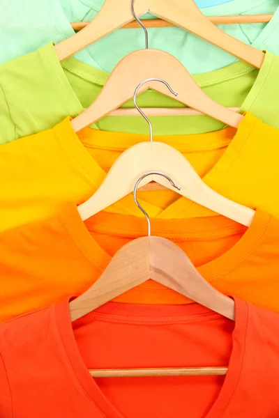T-shirts on hangers close-up — Stock Photo, Image