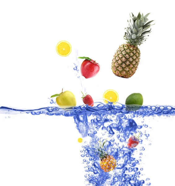 Fresh fruits dropped into water — Stock Photo, Image
