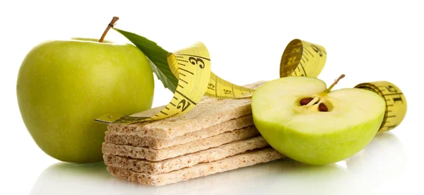 Green apples, crispbreads and measuring tape isolated on white — Stock Photo, Image