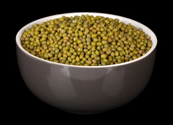 Mung beans in gray bowl isolated on black — Stock Photo, Image