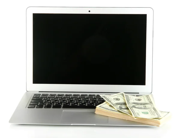 Geld op laptop geïsoleerd op wit — Stockfoto