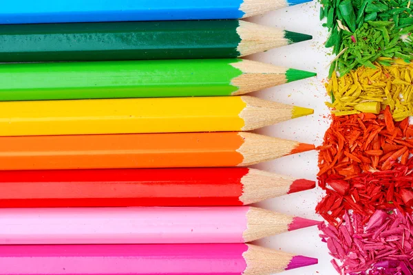 Colour pencils with sharpening shavings, close up — Stock Photo, Image