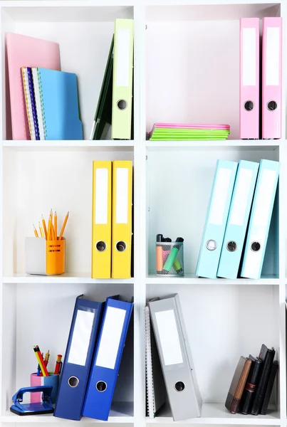 White office shelves with folders and different stationery, close up — Stock Photo, Image