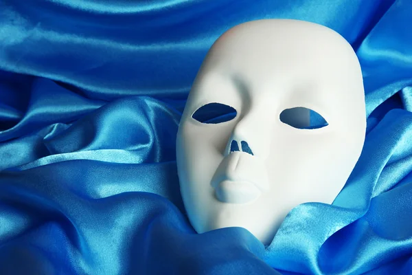 Mask on blue fabric background — Stock Photo, Image