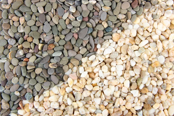Grijze en witte kleine zee stenen, close-up — Stockfoto