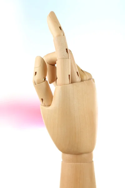 Wooden hand on light background — Stock Photo, Image