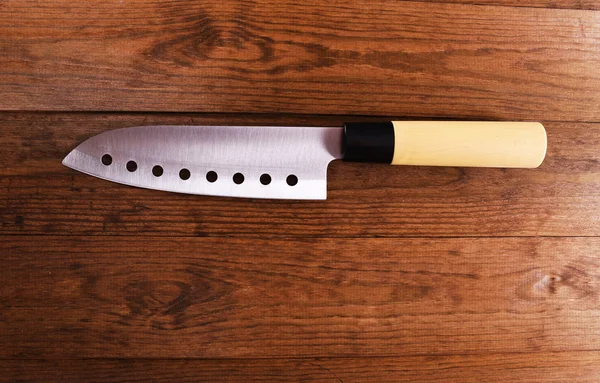 Kitchen knife on wooden background — Stock Photo, Image