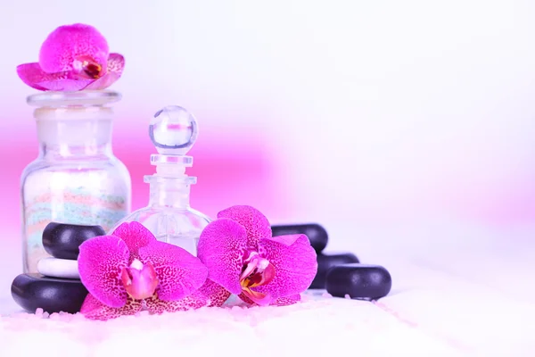 Beautiful spa setting with orchid on white wooden table on bright background — Stock Photo, Image