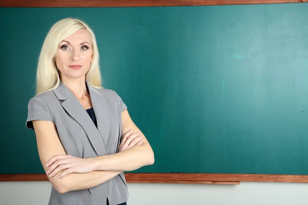 School teacher near blackboard close-up — Stock Photo, Image