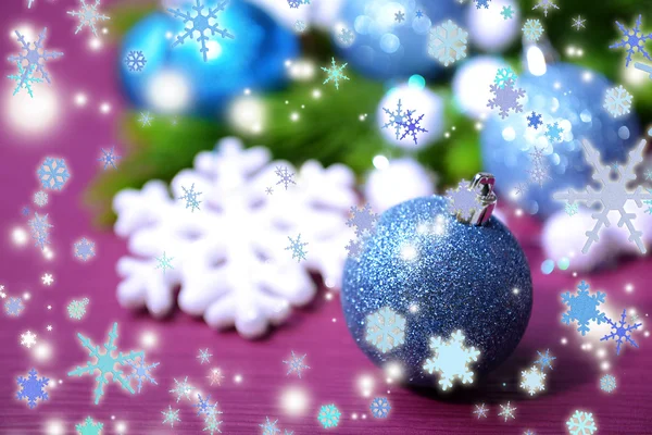 Christmas balls on fir tree, on color background — Stock Photo, Image