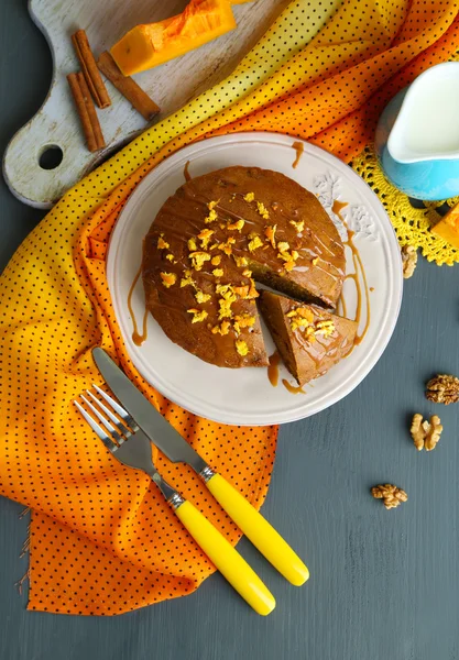 Delicious pumpkin pie on plate on wooden table close-up — Stock Photo, Image