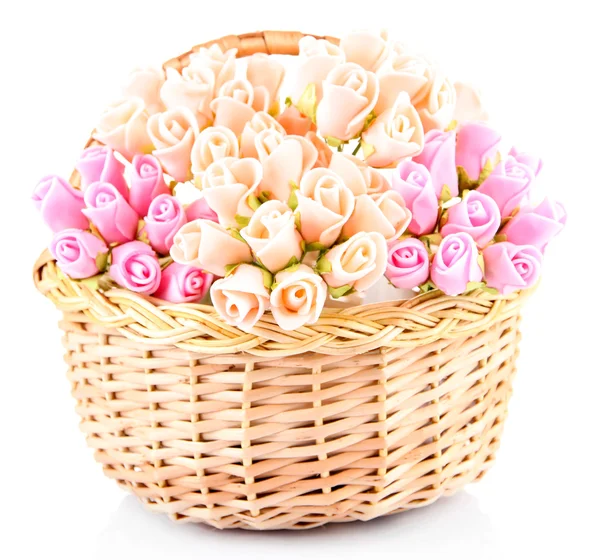 Bouquet of beautiful artificial flowers in wicker basket, isolated on white — Stock Photo, Image