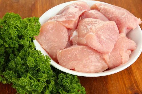 Raw turkey meat on wooden table close up — Stock Photo, Image