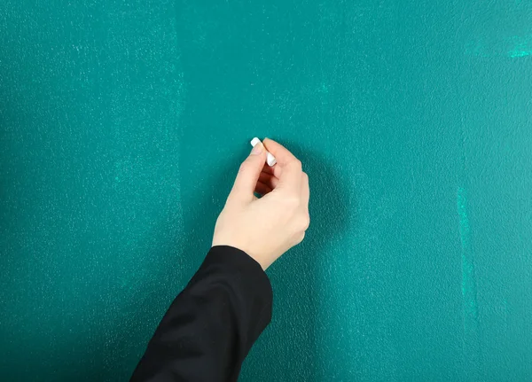 Hand writing on blackboard in class room — Stock Photo, Image