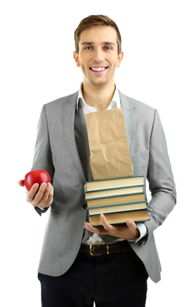 Jeune professeur avec des livres et pomme isolé sur blanc — Photo