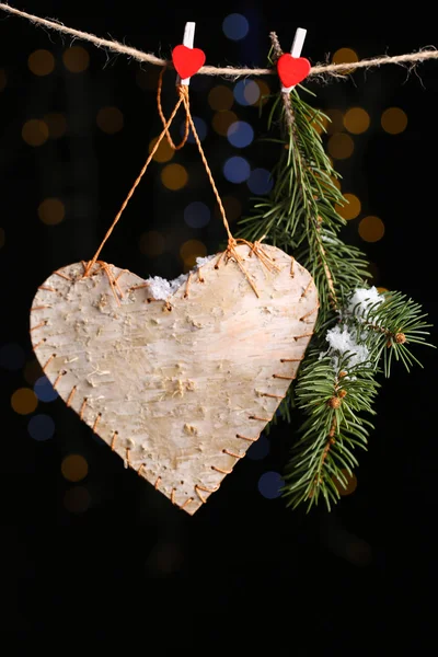 Decorative heart on rope on shiny background — Stock Photo, Image