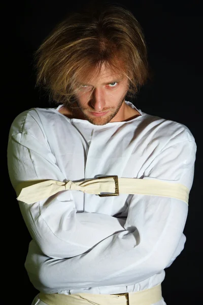 Mentally ill man in strait-jacket on black background — Stock Photo, Image