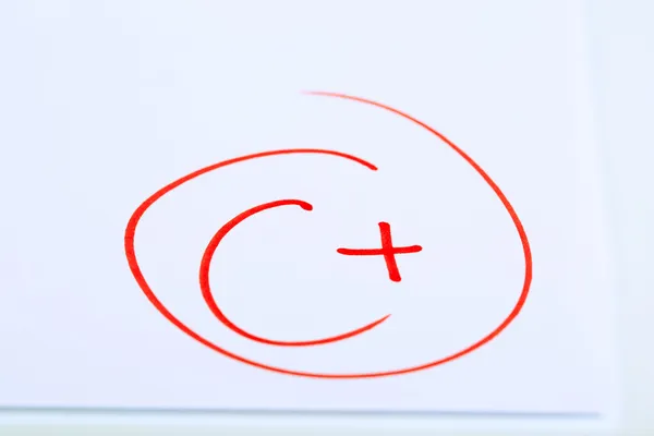 Grade C written on an exam paper — Stock Photo, Image