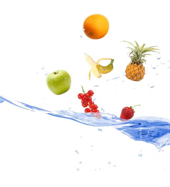 Fresh fruits dropped into water — Stock Photo, Image
