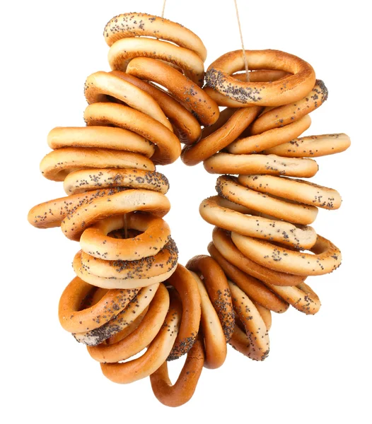 Tasty bagels on rope, isolated on white — Stock Photo, Image