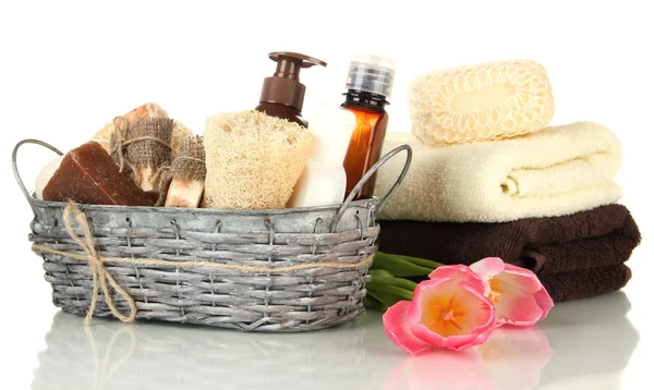 Composition of cosmetic bottles and soap in basket, isolated on white — Stock Photo, Image