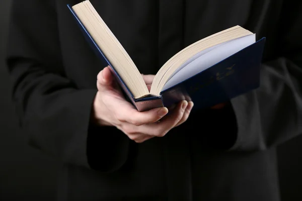 Priest reading from the holy bible, close up — Stock Photo, Image