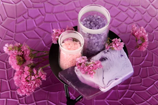 Hand made soap with sea salts on purple plate close-up — Stock Photo, Image