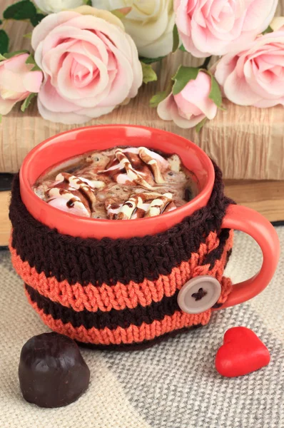 Cup with knitted thing on it close up — Stock Photo, Image