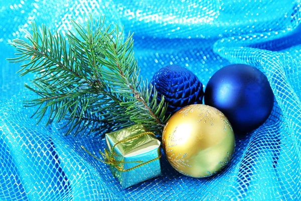 Beautiful Christmas decor on blue cloth — Stock Photo, Image