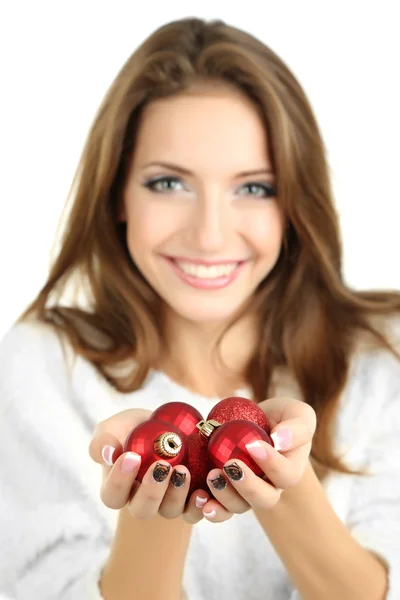 Beautiful smiling girl with Christmas toys isolated on white — Stock Photo, Image