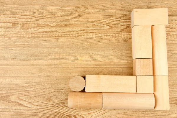 Wooden toy blocks on wooden background — Stock Photo, Image